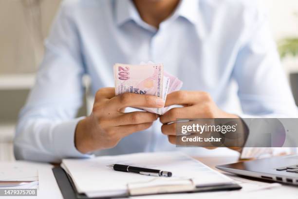 close-up businessman counting turkish money in office - turkish lira stock pictures, royalty-free photos & images