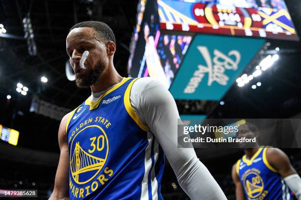 Stephen Curry of the Golden State Warriors walks off the court at halftime of a game against the Denver Nuggets at Ball Arena on April 2, 2023 in...