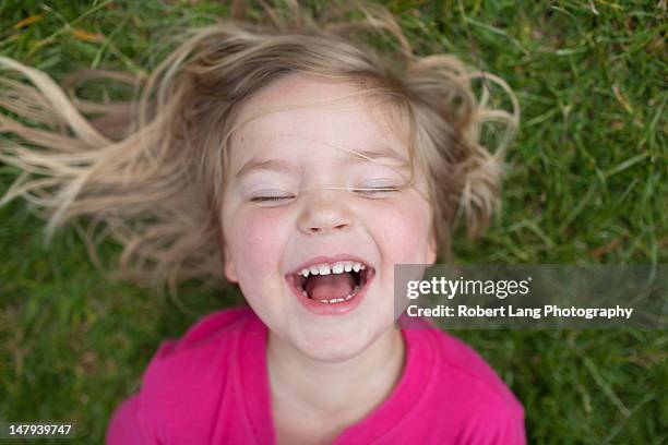 child laughing - 4 blond girls stock pictures, royalty-free photos & images