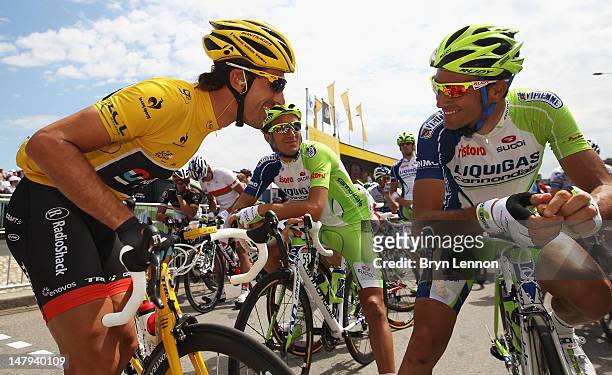 Race leader Fabian Cancellara of Switzerland and Radioshack-Nissan chats to Ivan Basso of Italy and Liquigas-Cannondale at the start of stage five of...