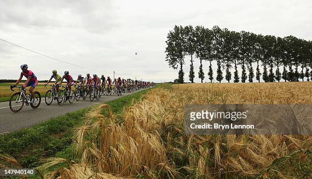 The peloton ride through the French countryside during stage five of the 2012 Tour de France from Rouen to Saint-Quentin on July 5, 2012 in...