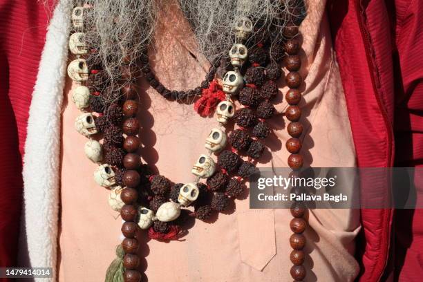 Hindu Sadhu or Mendicant with necklace of human skull shaped beads and rudraksha poses on March 5, 2023 in Mcleod Ganj, India