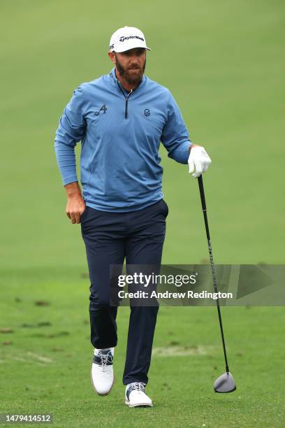 Dustin Johnson of the United States warms up on the practice area during a practice round prior to the 2023 Masters Tournament at Augusta National...