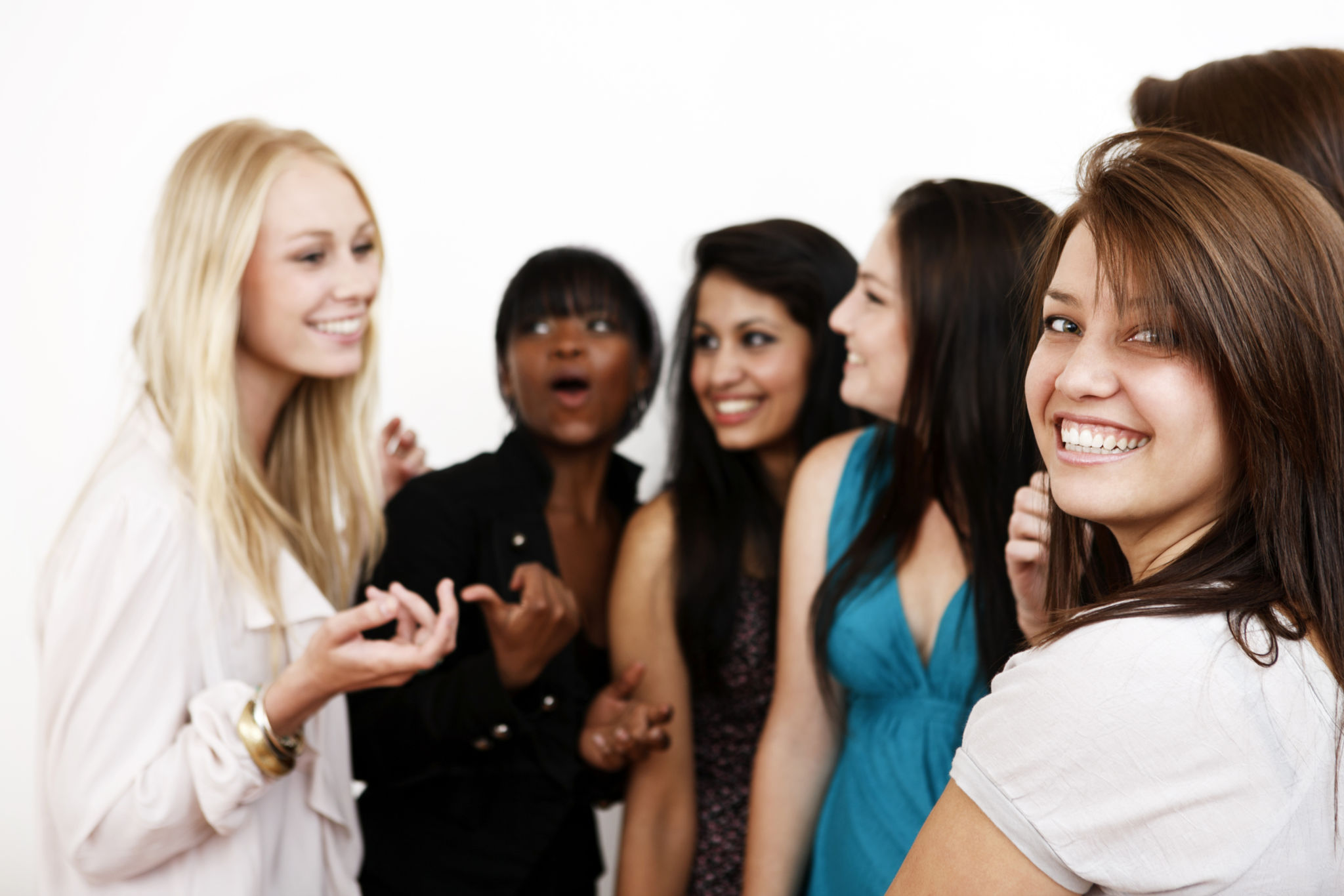 Group of young women smile and chat Group of young women smile and chat