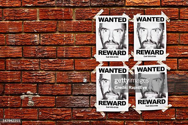 four &quot;wanted&quot; posters of scary looking man taped to wall - wanted poster stock pictures, royalty-free photos & images