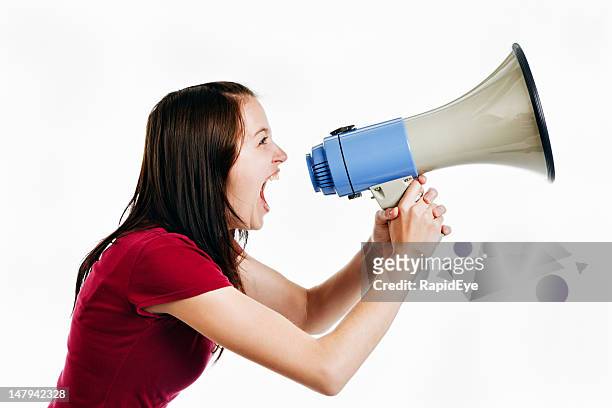 pretty brunette yells into loud hailer - public address system stock pictures, royalty-free photos & images