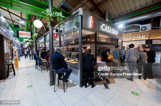 People eat at Casa Dani restaurant in Mercado de La Paz, on April 3 in Madrid, Spain. The Madrid restaurant Casa Dani, known for its iconic potato...