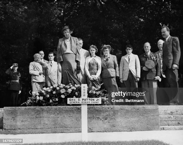 Eleanor Roosevelt , her son Elliott and two of his children pay their respects at the grave of General George S Patton of the US Third Army at the...