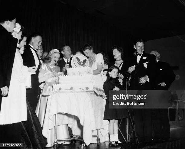 Fist Lady Eleanor Roosevelt pictured with celebrities taking part in the President's Birthday Ball fundraising activities for the National Foundation...