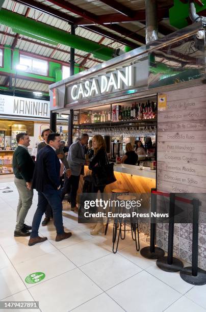 People eat at Casa Dani restaurant in Mercado de La Paz, on April 3 in Madrid, Spain. The Madrid restaurant Casa Dani, known for its iconic potato...