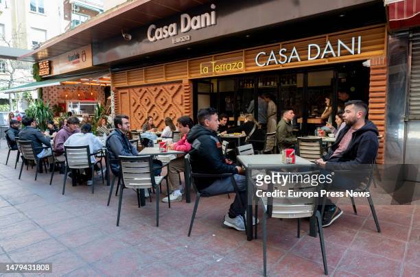 Several people eat on the terrace of the Casa Dani restaurant at Mercado de La Paz, on April 3 in Madrid, Spain. The Madrid restaurant Casa Dani,...