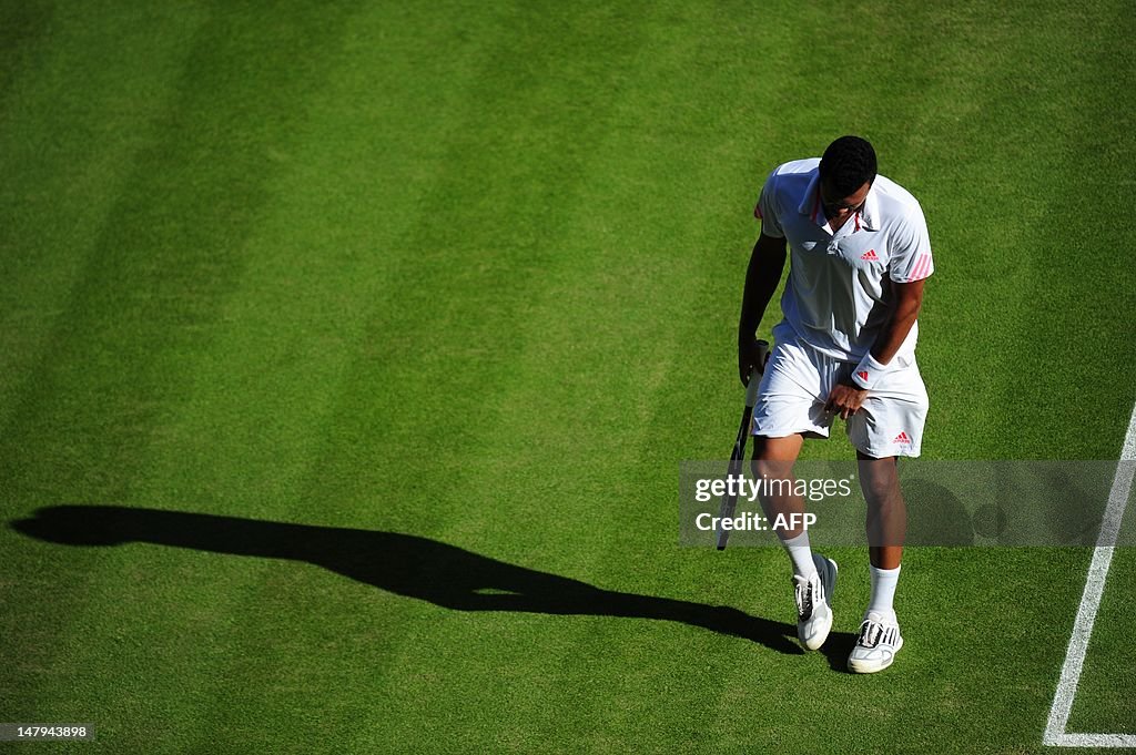 France's Jo-Wilfried Tsonga reacts after