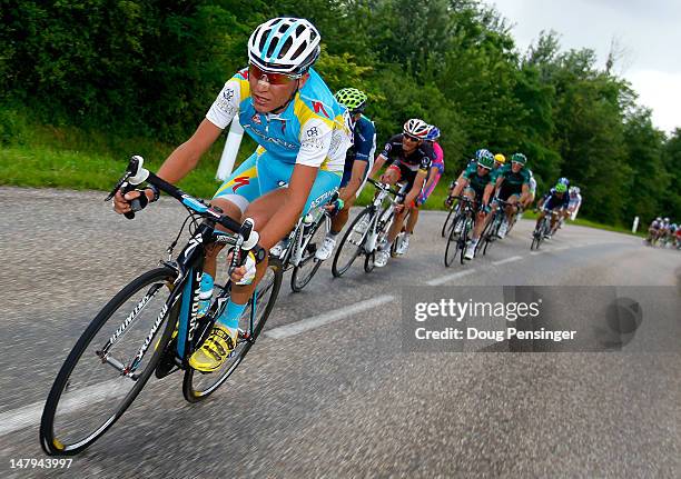 Janez Brajkovic of Slovenia tries to chase back to the peloton after being caught by a crash with 25km to the finish of stage six of the 2012 Tour de...