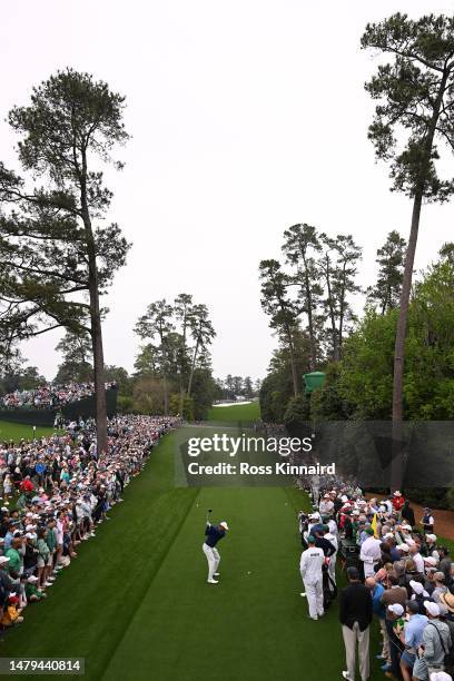 Tiger Woods of the United States plays his shot from the 18th tee during a practice round prior to the 2023 Masters Tournament at Augusta National...