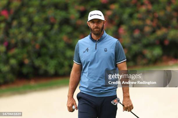 Dustin Johnson of the United States looks on from the 13th green during a practice round prior to the 2023 Masters Tournament at Augusta National...
