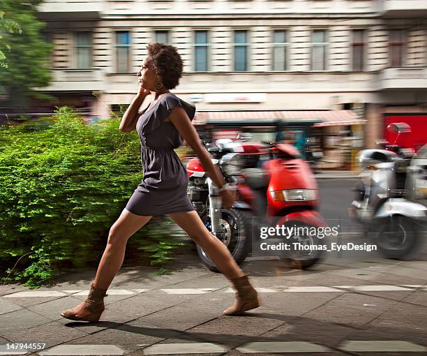 stylish woman walking and talking - ankle length stock pictures, royalty-free photos & images