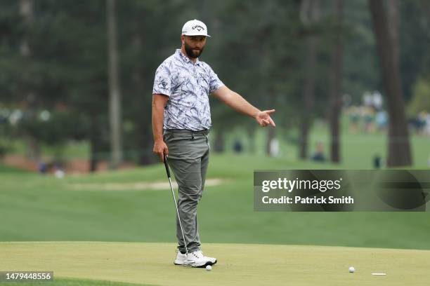 Jon Rahm of Spain reacts a putt on the third green during a practice round prior to the 2023 Masters Tournament at Augusta National Golf Club on...