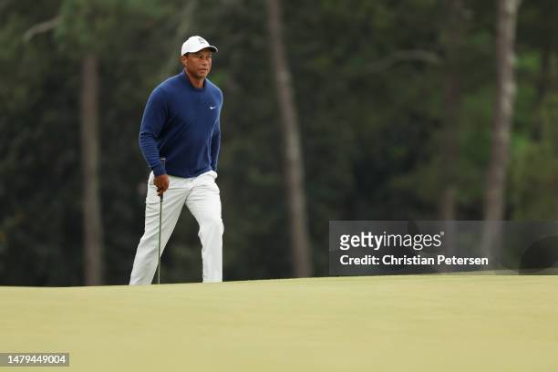 Tiger Woods of the United States walks to the 18th green during a practice round prior to the 2023 Masters Tournament at Augusta National Golf Club...