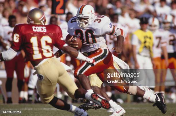 Stephen McGuire, Running Back for the University of Miami Hurricanes in motion running the football during the NCAA Big East Conference college...