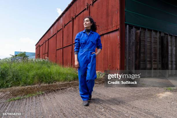 farm worker training on the job - blue jumpsuit stock pictures, royalty-free photos & images