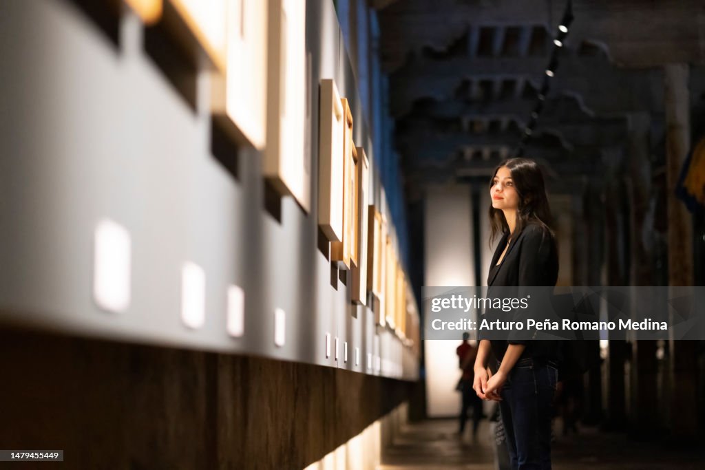 Young woman in art gallery