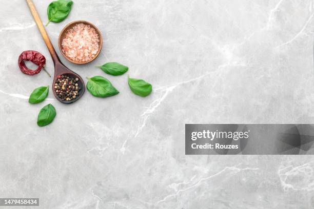 culinary border of basil, salt, pepper - table top view stock pictures, royalty-free photos & images