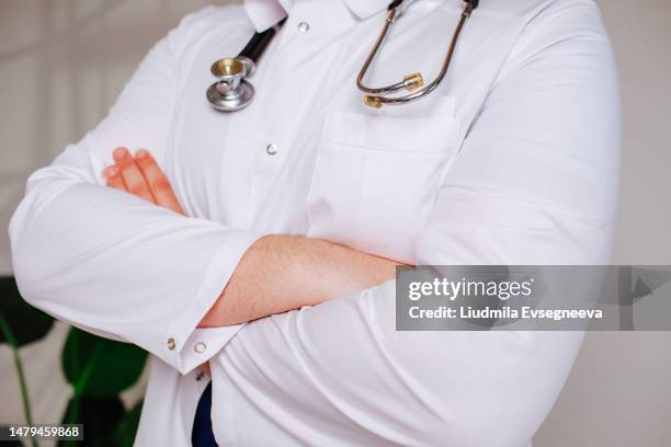 doctor in the cabinet - doctor coat stock pictures, royalty-free photos & images