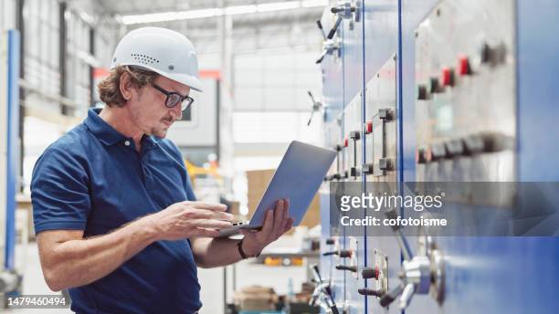 professional engineer checking quality control, and manufacturing operations - operations manager stock pictures, royalty-free photos & images