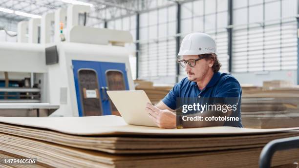 professional engineer checking quality control, and manufacturing operations - business people and paper imagens e fotografias de stock