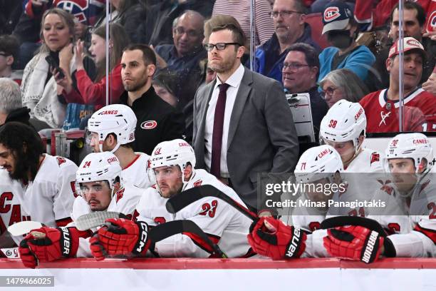 Assistant coach of the Carolina Hurricanes Tim Gleason works the bench during the third period against the Montreal Canadiens at Centre Bell on April...