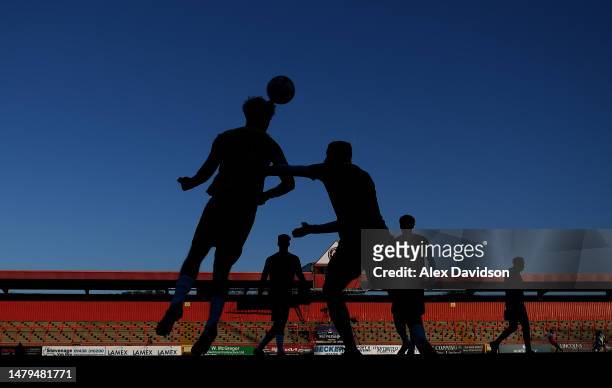 Members of the Tottenham Team warm up during the Premier League 2 match between Tottenham Hotspur U21 v Manchester City U21 at The Lamex Stadium on...