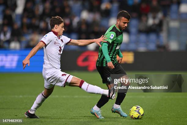 Matheus Henrique of US Sassuolo is challenged by Samuele Ricci of Torino FC during the Serie A match between US Sassuolo and Torino FC at Mapei...