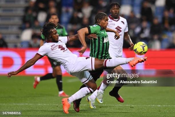 Armand Lauriente of US Sassuolo is challenged by Andreaw Gravillon of Torino FC during the Serie A match between US Sassuolo and Torino FC at Mapei...