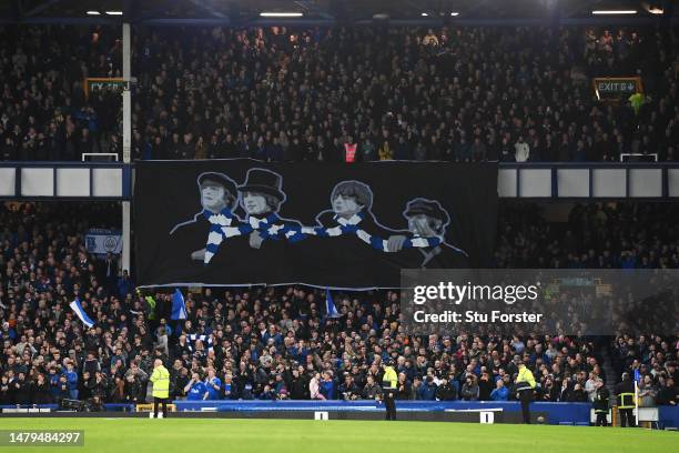 Fans show their support from the stands, displaying a banner of The Beatles wearing an Everton scarf, prior to the Premier League match between...