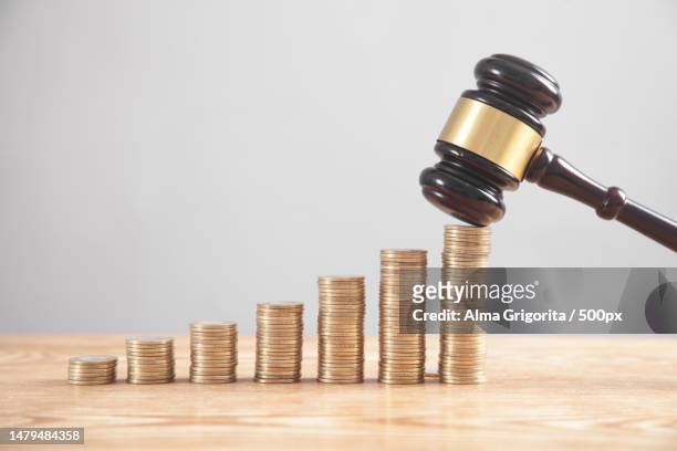 stack of coins with judge gavel,romania - auction stockfoto's en -beelden