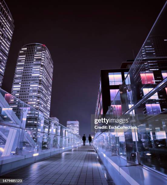 pedestrian overpass at makuhari business district, close to tokyo, japan - modern business people close up stock-fotos und bilder