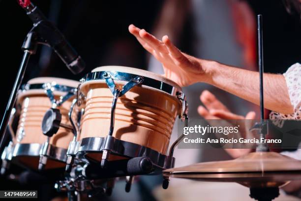hands playing percussion in a concert - baterista imagens e fotografias de stock