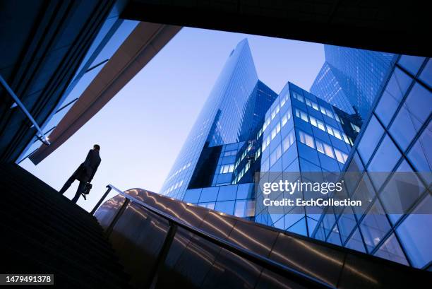 businessman on top of stairs at modern business district - la defense bildbanksfoton och bilder