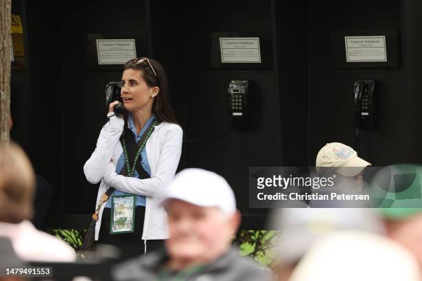 Patron uses a courtesy telephone during a practice round prior to the 2023 Masters Tournament at Augusta National Golf Club on April 03, 2023 in...
