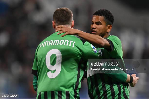 Andrea Pinamonti of US Sassuolo celebrates the team's first goal with teammate Rogerio during the Serie A match between US Sassuolo and Torino FC at...