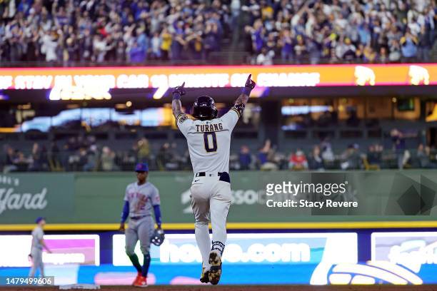 Brice Turang of the Milwaukee Brewers celebrates a grand slam against the New York Mets during the fifth inning of Opening Day at American Family...