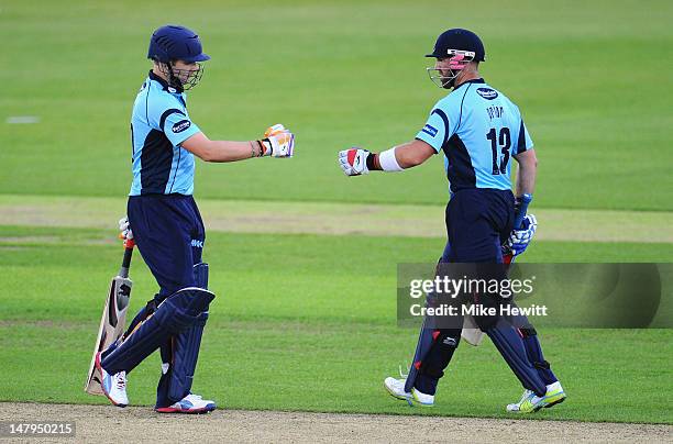 Luke Wright and Matt Prior of Sussex celeberate their 100 partnership during the Friends Life T20 match between Hampshire Royals and Sussex Sharks at...