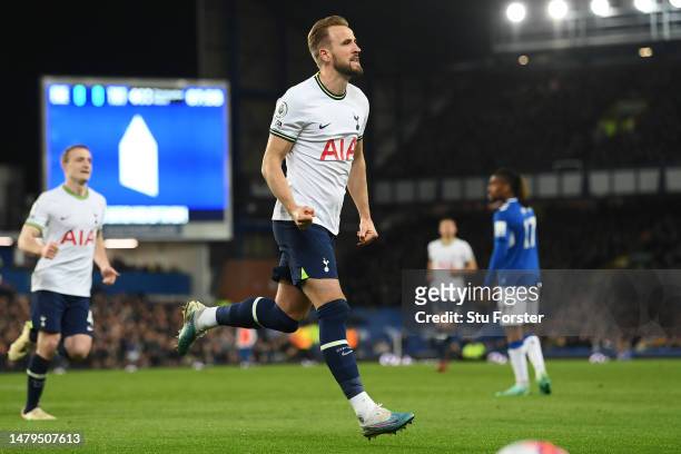 Harry Kane of Tottenham Hotspur celebrates after scoring the team's first goal from a penalty during the Premier League match between Everton FC and...