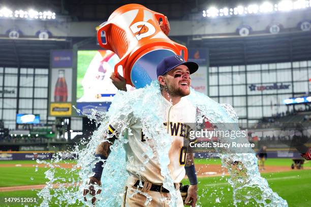 Brice Turang of the Milwaukee Brewers is dunked following a game against the New York Mets on Opening Day at American Family Field on April 03, 2023...