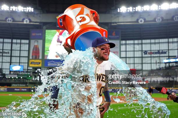 Brice Turang of the Milwaukee Brewers is dunked following a game against the New York Mets on Opening Day at American Family Field on April 03, 2023...