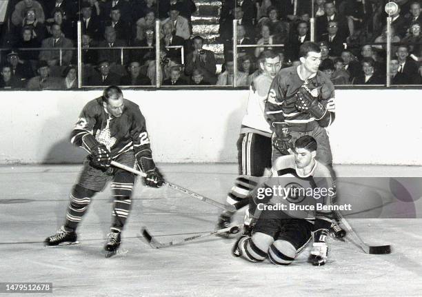 Eddie Shack is stopped by Gilles Marotte of the Boston Bruins in NHL action circa 1970 in New York, New York.