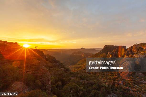 sunrise over dramatic mountain landscape scene - dawn australia stock pictures, royalty-free photos & images