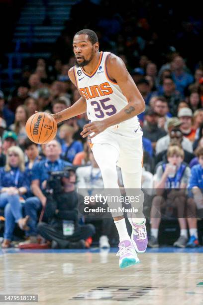 Kevin Durant of the Phoenix Suns dribbles up court during the second quarter against the Oklahoma City Thunder at Paycom Center on April 02, 2023 in...
