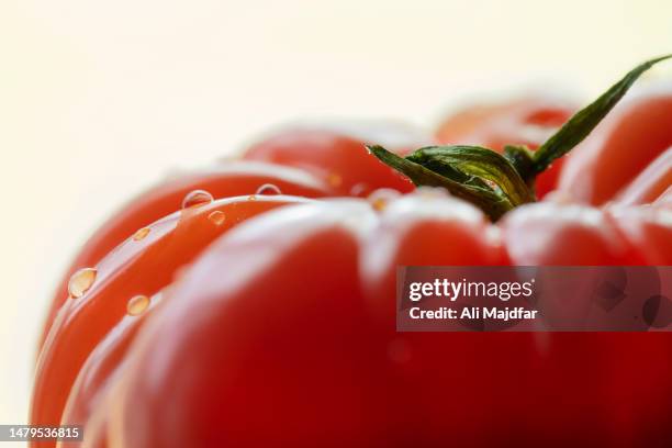 fresh tomato close up - tomato sauce isolated stock pictures, royalty-free photos & images