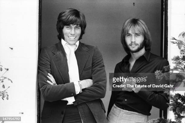 Singer songwriters and members of the musical trio the Bee Gees Barry Gibb and Maurice Gibb pose for a portrait in London, England in July 1969.